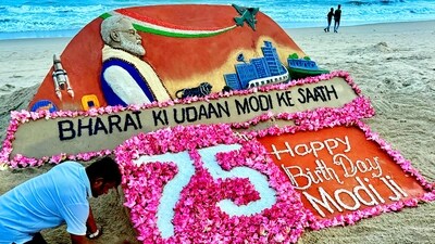 Sand artist Sudarsan Pattnaik makes a sculpture on the eve of Prime Minister Narendra Modi's 75th birthday on Puri beach, on Tuesday, (PTI) Sand artist Sudarsan Pattnaik makes a sculpture on the eve of Prime Minister Narendra Modi's 75th birthday on Puri beach, on Tuesday, (PTI)