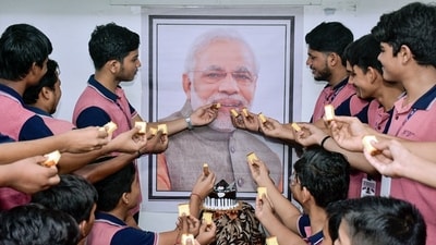 School students in Surat celebrate the birthday of Prime Minister Narendra Modi by offering a cake to his picture. (Ashok Munjani/ANI) School students in Surat celebrate the birthday of Prime Minister Narendra Modi by offering a cake to his picture. (Ashok Munjani/ANI)