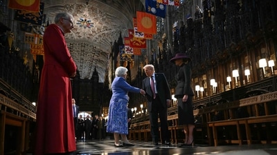 US President Donald Trump (2R) and US First Lady Melania Trump (R) meet Chapter Clerk of St George's Chapel Charlotte Manley (2L) as they tour the quire of St George's Chapel with Dean of Windsor Christopher Cocksworth (L) standing by at Windsor Castle, in Windsor, on September 17, 2025, during the US president's second State Visit. (AFP) US President Donald Trump (2R) and US First Lady Melania Trump (R) meet Chapter Clerk of St George's Chapel Charlotte Manley (2L) as they tour the quire of St George's Chapel with Dean of Windsor Christopher Cocksworth (L) standing by at Windsor Castle, in Windsor, on September 17, 2025, during the US president's second State Visit. (AFP)