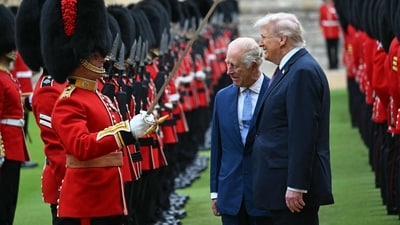 Britain's King Charles III (C) and US President Donald Trump (R) talk with a Coldstream Guardsman as they inspect the guard of honour during a ceremonial welcome in the Quadrangle at Windsor Castle, in Windsor, on September 17, 2025, during the US president's second State Visit. (AFP) Britain's King Charles III (C) and US President Donald Trump (R) talk with a Coldstream Guardsman as they inspect the guard of honour during a ceremonial welcome in the Quadrangle at Windsor Castle, in Windsor, on September 17, 2025, during the US president's second State Visit. (AFP)