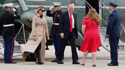 President Donald Trump, center, and first lady Melania Trump, top left, are greeted by Air Force Col. Christopher M. Robinson, Commander, 89th Airlift Wing, right, and his wife Stephanie Robinson, second from right, before walking to board Air Force One, Tuesday, Sept. 16, 2025, at Joint Base Andrews, Md. (AP Photo/Luis M. Alvarez) (AP) President Donald Trump, center, and first lady Melania Trump, top left, are greeted by Air Force Col. Christopher M. Robinson, Commander, 89th Airlift Wing, right, and his wife Stephanie Robinson, second from right, before walking to board Air Force One, Tuesday, Sept. 16, 2025, at Joint Base Andrews, Md. (AP Photo/Luis M. Alvarez) (AP)