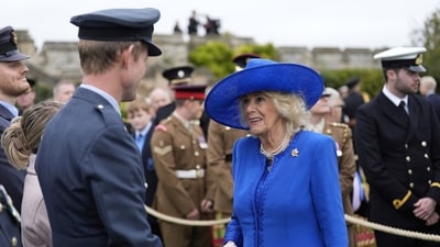 Britain's Queen Camilla meets military personal after watching a Beating Retreat military ceremony at Windsor Castle, England, on Wednesday Sept. 17, 2025, day one of U.S. President Donald Trump's second state visit to the UK. (Andrew Matthews/PA via AP, Pool) (AP) Britain's Queen Camilla meets military personal after watching a Beating Retreat military ceremony at Windsor Castle, England, on Wednesday Sept. 17, 2025, day one of U.S. President Donald Trump's second state visit to the UK. (Andrew Matthews/PA via AP, Pool) (AP)