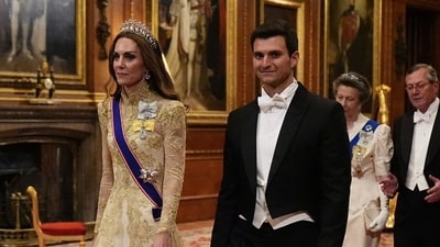The Princess of Wales walks with Michael Boulos. (via REUTERS)