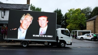 An image of U.S. President Donald Trump alongside disgraced financier Jeffrey Epstein is displayed on a vehicle on the day of the state visit of the U.S. President and first lady Melania Trump, in Windsor, Britain, September 17, 2025. REUTERS/Phil Noble (REUTERS)