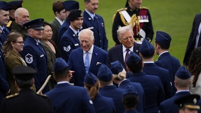 US President Donald Trump and King Charles III speak to military personnel following a Beating Retreat military ceremony at Windsor Castle, Berkshire, on day one of the president's second state visit to the UK. Picture date: Wednesday September 17, 2025.    Jordan Pettitt/Pool via REUTERS (via REUTERS)