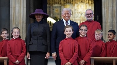 President Donald Trump and first lady Melania Trump pose with a childrens choir as they receive a tour of St. George’s Chapel at Windsor Castle, Windsor, England, Wednesday, Sept. 17, 2025.  Evan Vucci/Pool via REUTERS     TPX IMAGES OF THE DAY (via REUTERS)