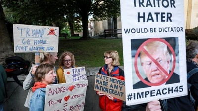 People held placards and poster calling Trump a traitor, hater and would be dictator. REUTERS/Phil Noble (REUTERS)