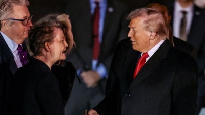 U.S. President Donald Trump shakes hands with British Foreign Secretary Yvette Cooper as he and U.S. first lady Melania Trump arrive for their state visit to Britain, at London Stansted Airport near London, Britain, September 16, 2025. REUTERS/Chris Radburn (REUTERS)