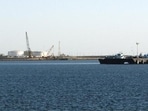 A speed boat passes by oil docks at the port of Kalantari in the city of Chabahar, east of the Strait of Hormuz (REUTERS FILE PHOTO)