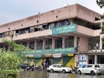 An activist approached the state human rights panel, pointing to leaking roof and other damages at MC Zone C office . (HT Photo)