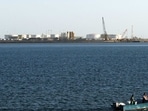 A speed boat passes by oil docks at the port of Kalantari in the city of Chabahar, east of the Strait of Hormuz. 