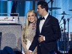 Charlie Kirk (R) and and his wife Erika Lane Frantzve (L) on stage during the Turning Point USA Inaugural-Eve Ball Charlie Kirk (R) and and his wife Erika Lane Frantzve (L) on stage during the Turning Point USA Inaugural-Eve Ball