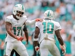 Miami Dolphins wide receiver Tyreek Hill (10) celebrates with wide receiver Jaylen Waddle (17) 
