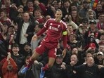 Liverpool's Virgil van Dijk celebrates after scoring his side's third goal during the Champions League match against Atletico Madrid in Liverpool. (AP)