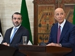 Syrian Foreign Minister Asaad al-Shaibani (L) watches as US special envoy for Syria Tom Barrack speaks.