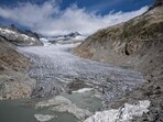 The Rhone Glacier, with some insulating foam covering a small part to prevent it from melting next to its glacial lake, formed by the melting of the glacier due to global warming. (AFP File Photo)