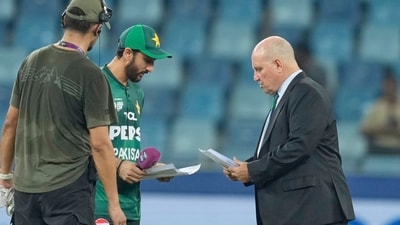 Pakistan's captain Salman Agha shares team list with match referee Andy Pycroft at the toss during against UAE (AP) Pakistan's captain Salman Agha shares team list with match referee Andy Pycroft at the toss during against UAE (AP)