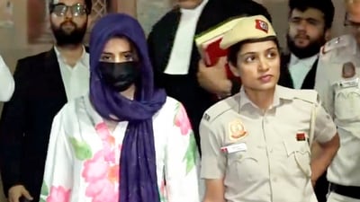 Gaganpreet Kaur, accused in the BMW accident case, is being brought to the judge's residence. (PTI) Gaganpreet Kaur, accused in the BMW accident case, is being brought to the judge's residence. (PTI)