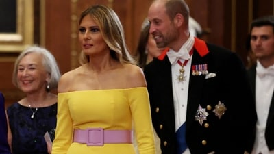 US First Lady Melania Trump arrived to attend a State Banquet at Windsor Castle in an off-shoulder bright yellow dress, clinched at the waist with a baby pink belt. (Photo by Anna Moneymaker / POOL / AFP) (AFP) US First Lady Melania Trump arrived to attend a State Banquet at Windsor Castle in an off-shoulder bright yellow dress, clinched at the waist with a baby pink belt. (Photo by Anna Moneymaker / POOL / AFP) (AFP)
