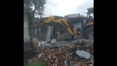 Bulldozers in action in Salawa village under the Sardhana police station limits, on Thursday. (HT Photo)