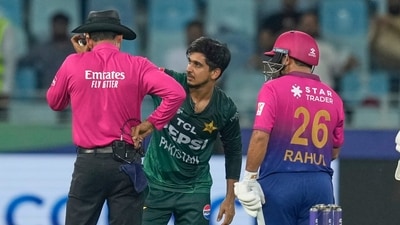 Pakistan's Saim Ayub checks the head of Umpire Ruchira Palliyaguruge, after he was hit by a ball during the Asia Cup cricket match. (AP) Pakistan's Saim Ayub checks the head of Umpire Ruchira Palliyaguruge, after he was hit by a ball during the Asia Cup cricket match. (AP)