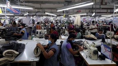 Workers sew winter garments at a Gokaldas garment facility in Bengaluru, India, September 16. (REUTERS)