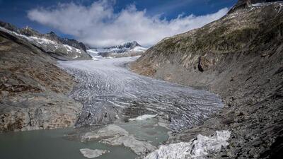 The Rhone Glacier, with some insulating foam covering a small part to prevent it from melting next to its glacial lake, formed by the melting of the glacier due to global warming. (AFP File Photo) The Rhone Glacier, with some insulating foam covering a small part to prevent it from melting next to its glacial lake, formed by the melting of the glacier due to global warming. (AFP File Photo)