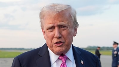 President Donald Trump speaks with reporters before boarding Air Force One at Morristown Airport, on Sunday. (AP) President Donald Trump speaks with reporters before boarding Air Force One at Morristown Airport, on Sunday. (AP)