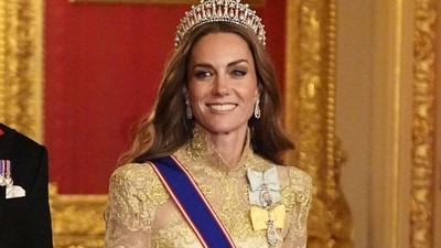 Catherine, Princess of Wales chose a floor-length Phillipa Lepley gown for the state banquet. Atop the simple gown, she wore a gold overlay with a high neckline and long sleeves. Aaron Chown/Pool via REUTERS (via REUTERS)