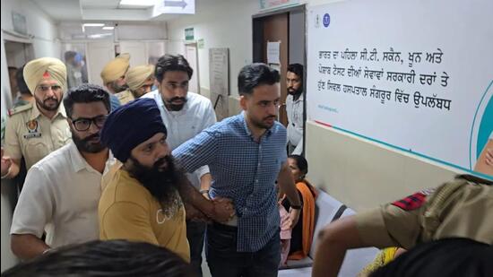Accused Sandeep Singh (centre) being brought for his medical examination to the civil hospital in Sangrur on Thursday. (HT Photo)