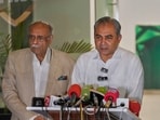 Pakistan's Interior Minister and Chairman of Pakistan Cricket Board, Mohsin Naqvi, center, speaks as former cricket board heads Najam Sethi, left, looks