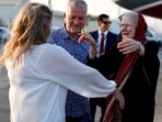 Barbie Reynolds, released from Taliban detention in Afghanistan, greeted by her daughter Sarah Entwistle after disembarking from a plane in Doha, 