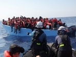 Crew of the migrant search and rescue ship Sea-Watch 5, operated by the German NGO Sea-Watch, carry out a rescue operation for migrants aboard an overcrowded boat in the Search and Rescue (SAR) zone in the central Mediterranean, off Libya,