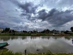 A man fishes in the Jhelum river as clouds cover the skyline, in Srinagar. A man fishes in the Jhelum river as clouds cover the skyline, in Srinagar.