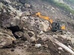 Road clearance work underway after landslide triggered heavy rains, in Kinnaur, on Thursday. (ANI)