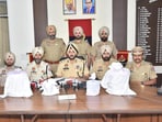 Two women, including a government schoolteacher, were among six people held for trafficking drugs in two separate operations. A total of 9.066kg of heroin was seized from them, said Punjab director general of police Gaurav Yadav.