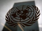 FILE PHOTO: The United Nations headquarters building is pictured though a window with the UN logo in the foreground in the Manhattan borough of New York August 15, 2014.    REUTERS/Carlo Allegri/File Photo