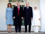 US President Donald Trump and first lady Melania Trump stand with Turkey's President Tayyip Erdogan and Emine Erdogan at the White House in 2019