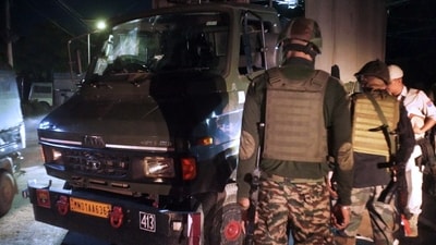 Security personnel stand near an Assam Rifles vehicle after a terrorist attack on it in Nambol Sabal area, in Bishnupur on Friday. (ANI) Security personnel stand near an Assam Rifles vehicle after a terrorist attack on it in Nambol Sabal area, in Bishnupur on Friday. (ANI)