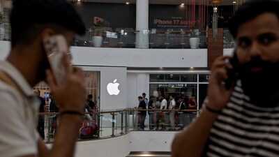 People wait in a queue outside an Apple retail store, as the iPhone 17 series goes on sale, in New Delhi. (REUTERS)