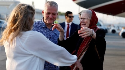 Barbie Reynolds, released from Taliban detention in Afghanistan, greeted by her daughter Sarah Entwistle after disembarking from a plane in Doha, (REUTERS)