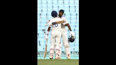Devdutt Paddikal and Dhruv Jurel hug it out after the former’s century in Lucknow on Friday. (Sourced)