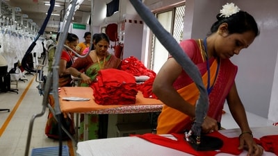 Workers iron garments at a garment facility in Bengaluru (REUTERS)