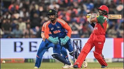 Oman's Aamir Kaleem (R) plays a shot during the Asia Cup 2025 Twenty20 international cricket match between India and Oman at the Sheikh Zayed Cricket Stadium in Abu Dhabi on September 19, 2025. (Photo by Sajjad HUSSAIN / AFP) (AFP)