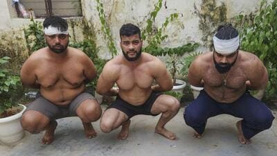 Police detain three accused for allegedly assaulting a hotel owner and his father over payment dispute in Gurugram on Friday. (PTI) Police detain three accused for allegedly assaulting a hotel owner and his father over payment dispute in Gurugram on Friday. (PTI)