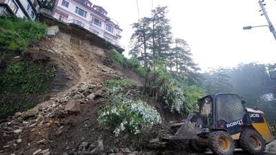Repair and restoration work underway after a landslide triggered by heavy overnight rainfall in Shimla on Friday. (PTI Photo) Repair and restoration work underway after a landslide triggered by heavy overnight rainfall in Shimla on Friday. (PTI Photo)