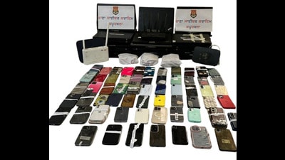 The police have recovered 40 laptops, 67 mobile phones and ₹10 lakh in cash during the raid, police said. (HT) The police have recovered 40 laptops, 67 mobile phones and ₹10 lakh in cash during the raid, police said. (HT)