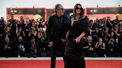 Monica Bellucci poses with director Tim Burton at the screening of Beetlejuice Beetlejuice at the Venice Film Festival 2024. (REUTERS)