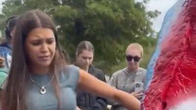 A UNCW student was seen defacing a Charlie Kirk mural (X) A UNCW student was seen defacing a Charlie Kirk mural (X)