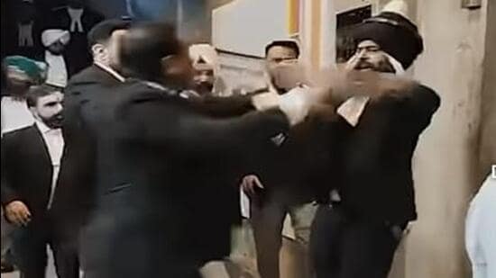 High drama was seen on Wednesday as the suspended lawyer Simranjit Singh Blassi, wearing a nihang attire underneath his suit, allegedly attacked and threatened lawyers with a sword, reportedly in support of lawyer Ravneet Kaur. (HT)